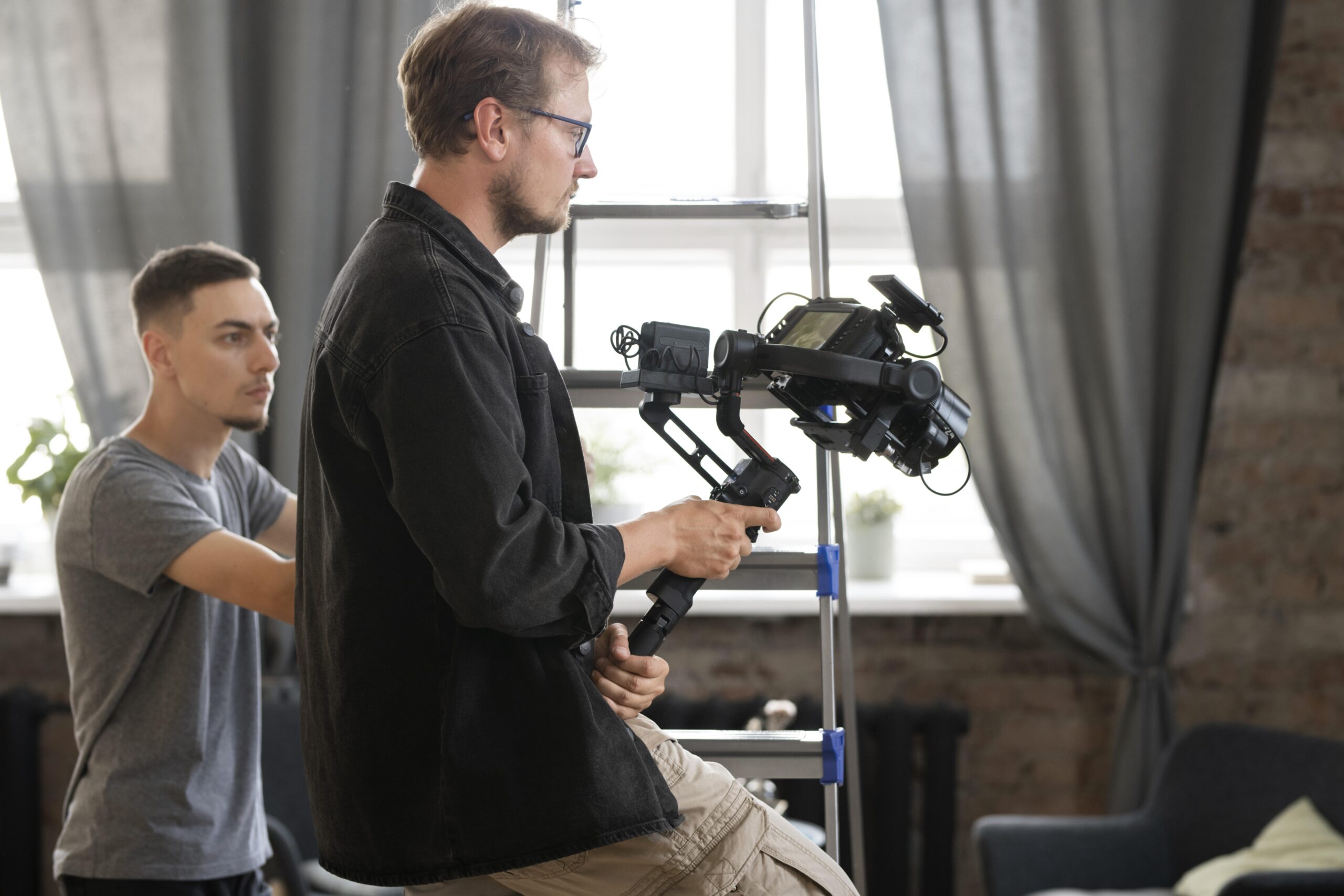 man filming with professional camera new movie