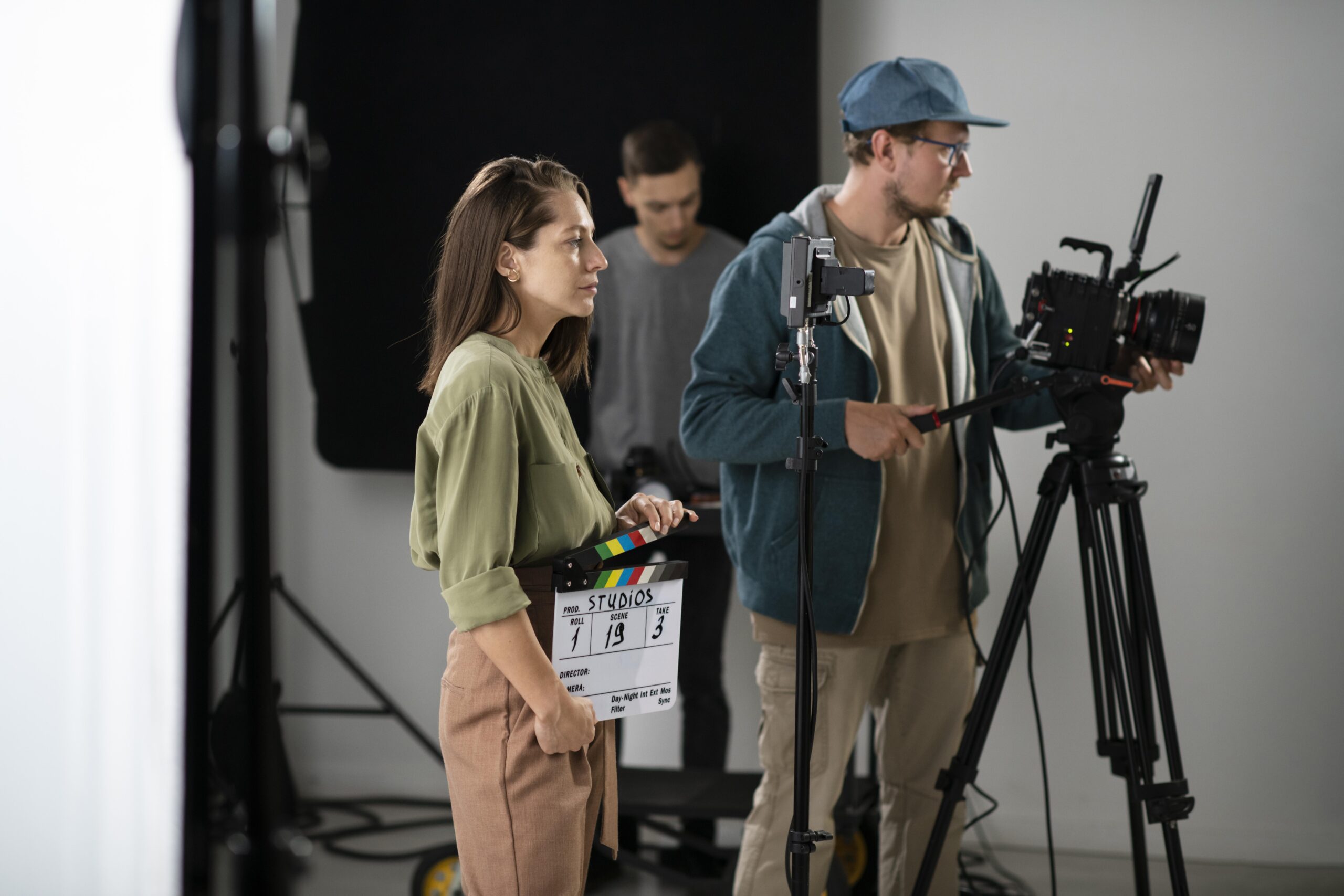 man filming with professional camera